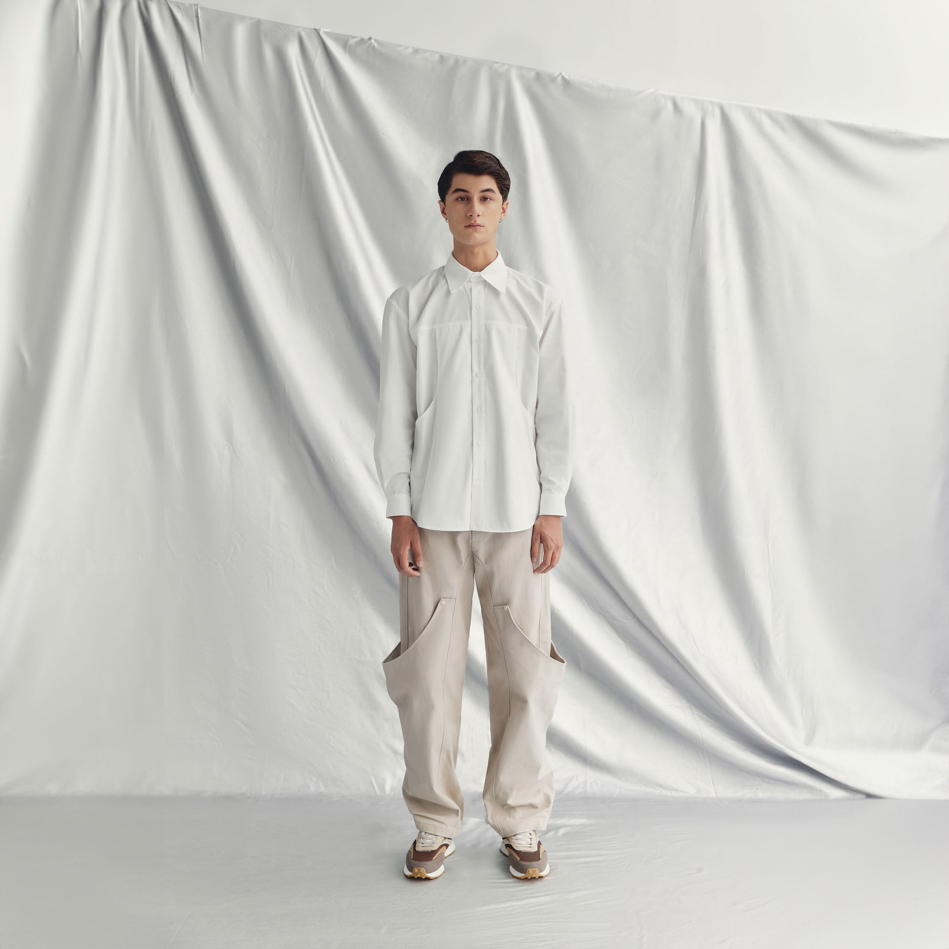 ADERSEN PANTS | BEIGE with a straight silhouette, wide legs, elasticated back, and unique cover design for a rebellious style.