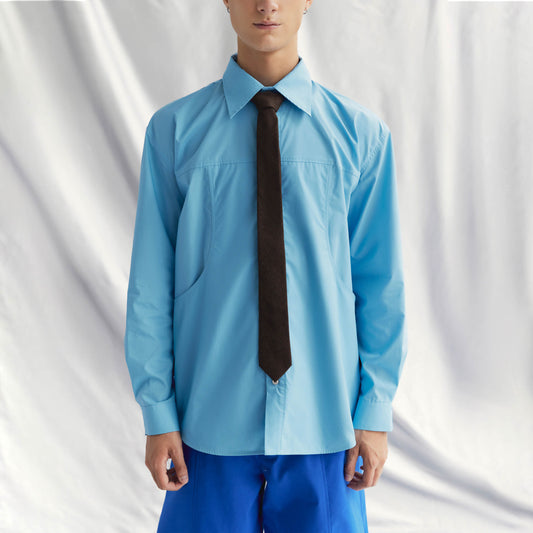 DANS SHIRT | BLUE with lapel collar, buttoned cuffs, front button closure, and distinctive layered design.