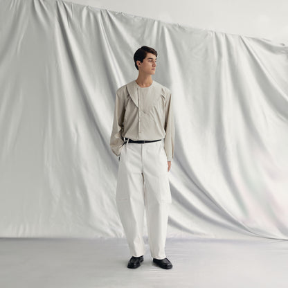 JAKOB PANTS | WHITE made from khaki cotton with an elasticated waistband and knee zippers for adjustable styling.